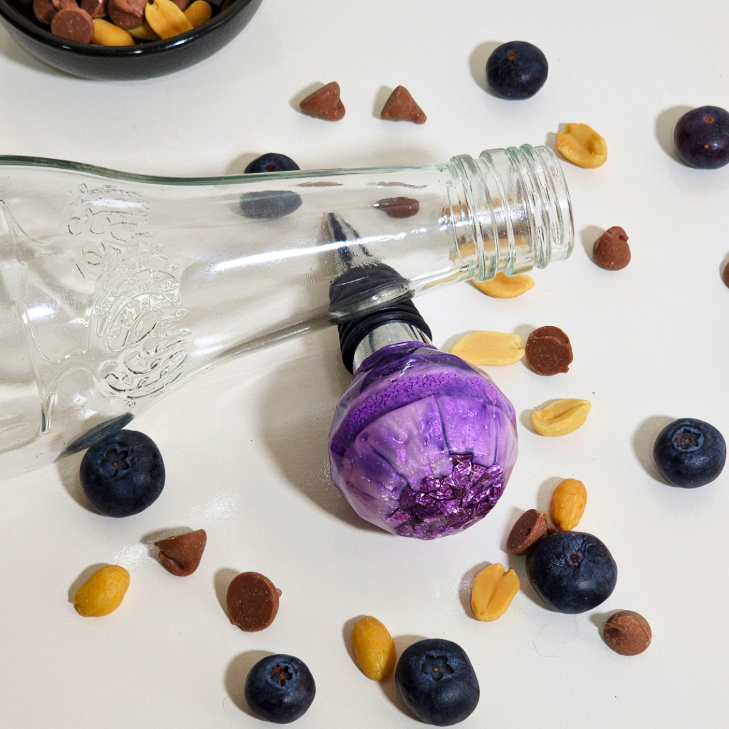 69a53347e6f476195c1e68ac_purple-bottle-stopper_1787047129242.png