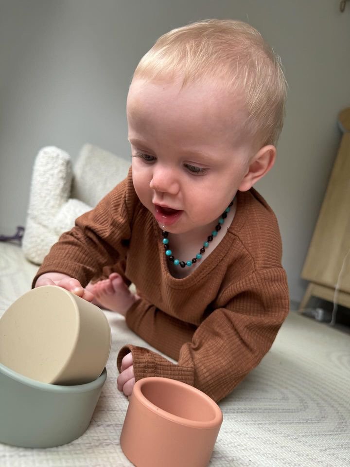69a53347e6f476195c1e68ac_sensory-play-with-stacking-cups_1780890194501.jpeg
