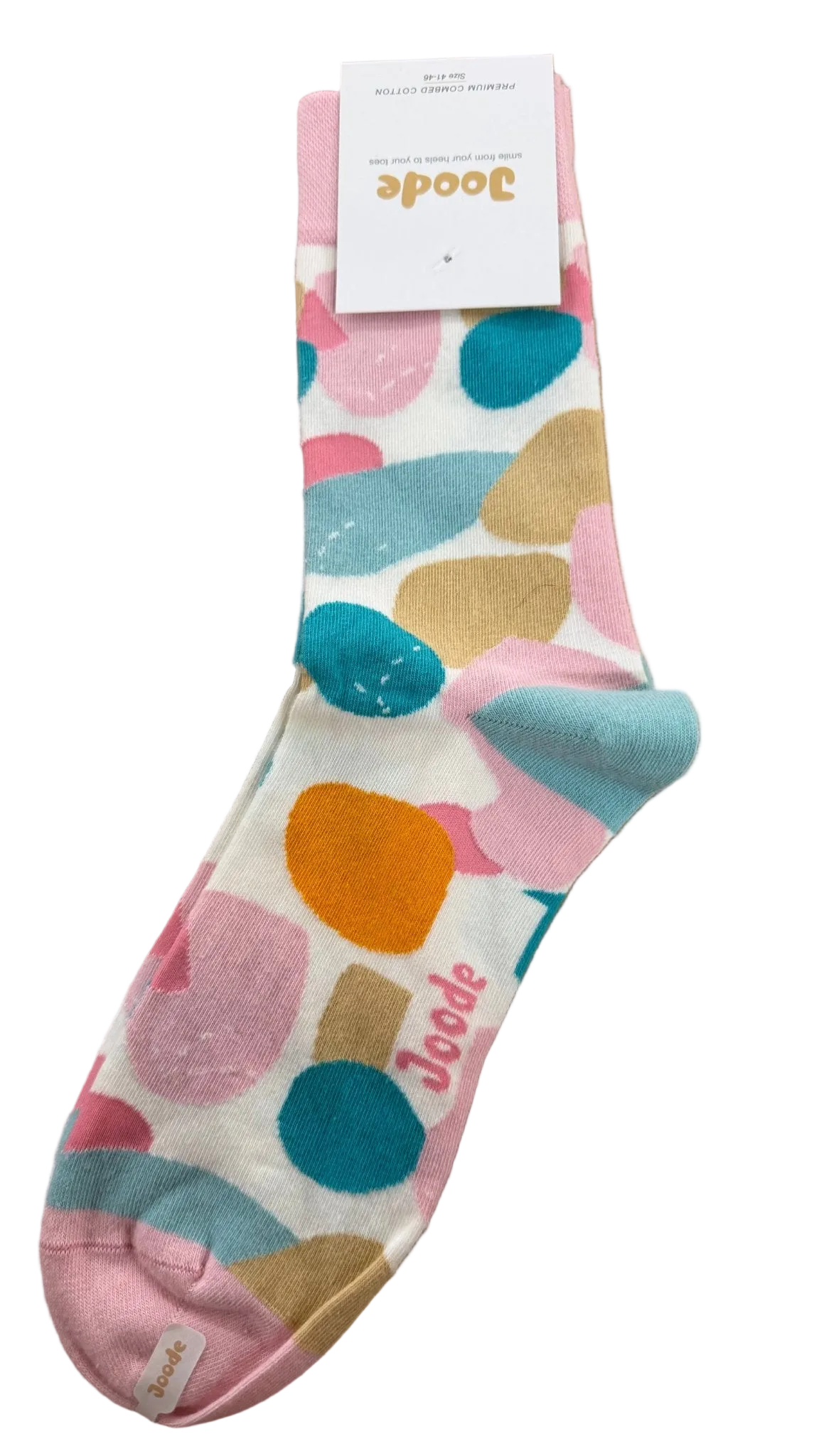 A single sock from the brand Joode, featuring a colorful abstract polka dot pattern in pink, teal, orange, and beige on a white background, complete with its white paper tag attached.