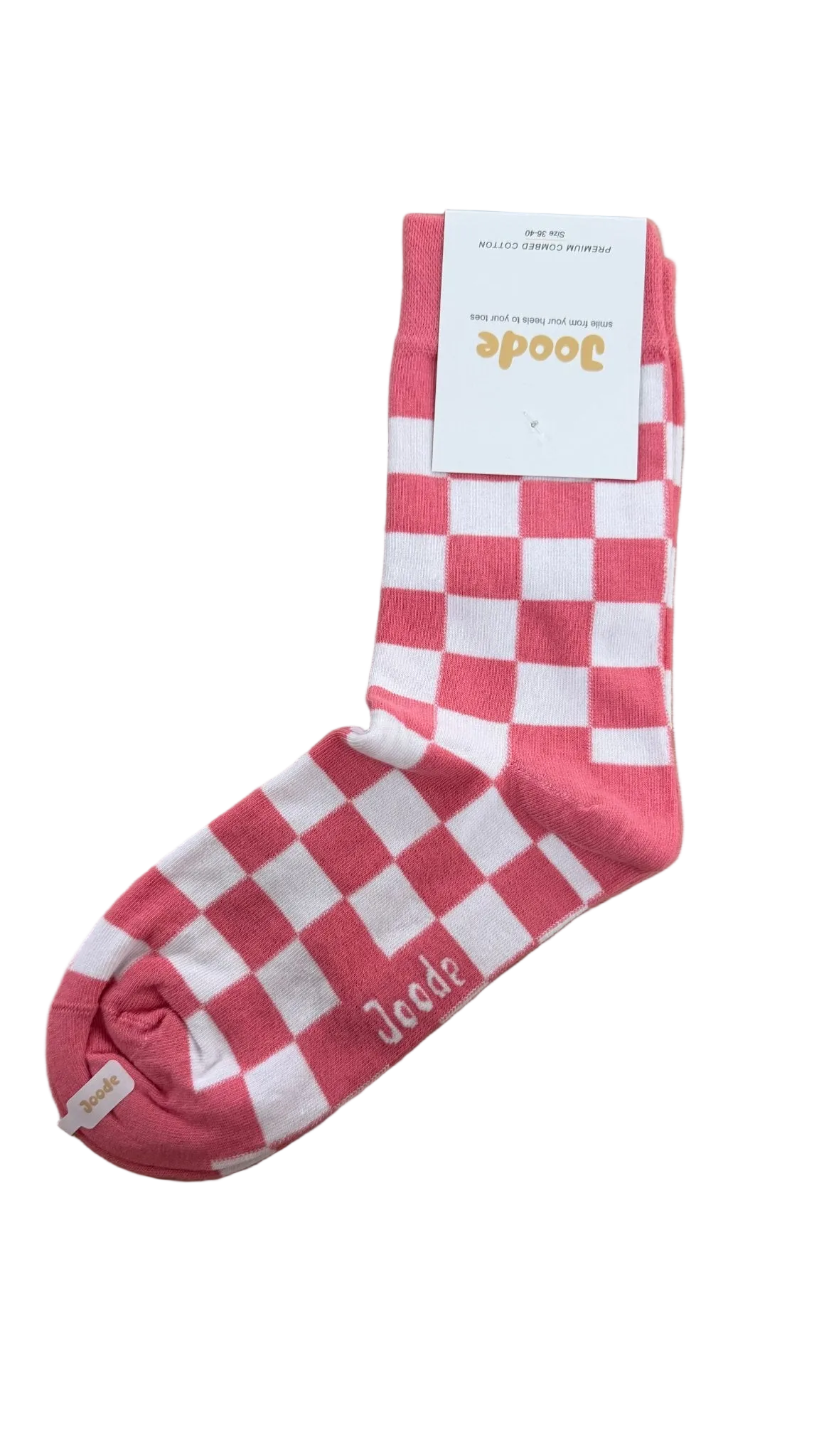 A single pink and white checkered sock with a white paper tag attached, placed on a light brown wooden surface. The sock has the brand name 'JooDee' printed near the toe.