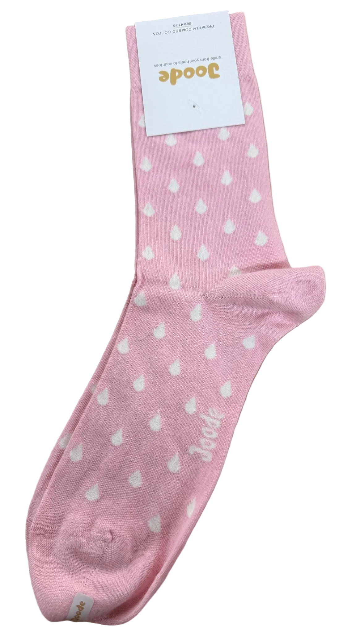 A single pink crew sock with a white heart pattern, shown with its white paper tag on a wooden surface. The brand name 'Boodee' is visible on the tag and printed on the sock.