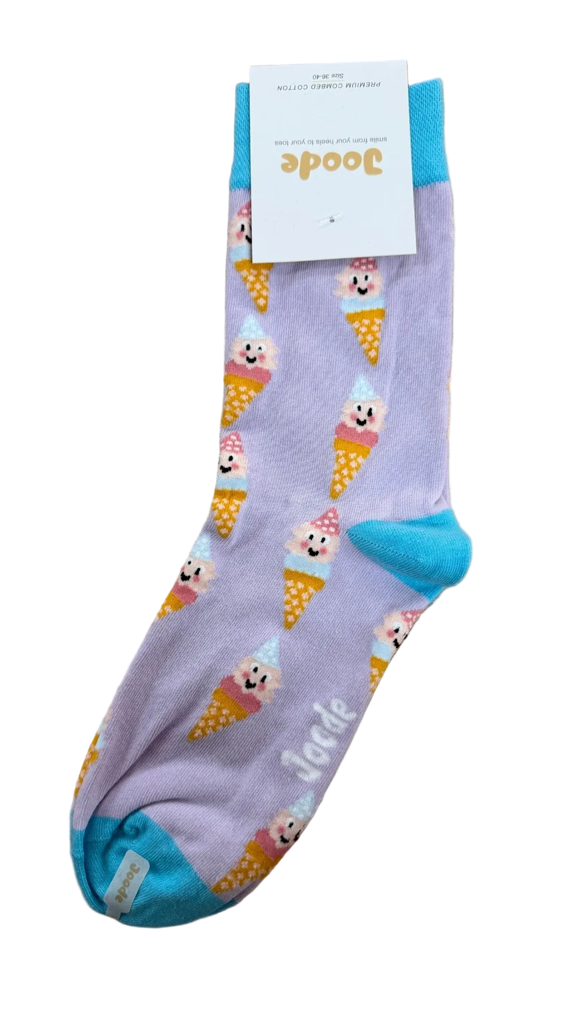 A single light purple ankle sock with a playful pattern of smiling ice cream cones and bright blue heels, toes, and cuffs, shown on a wooden floor with its white cardboard tag attached.