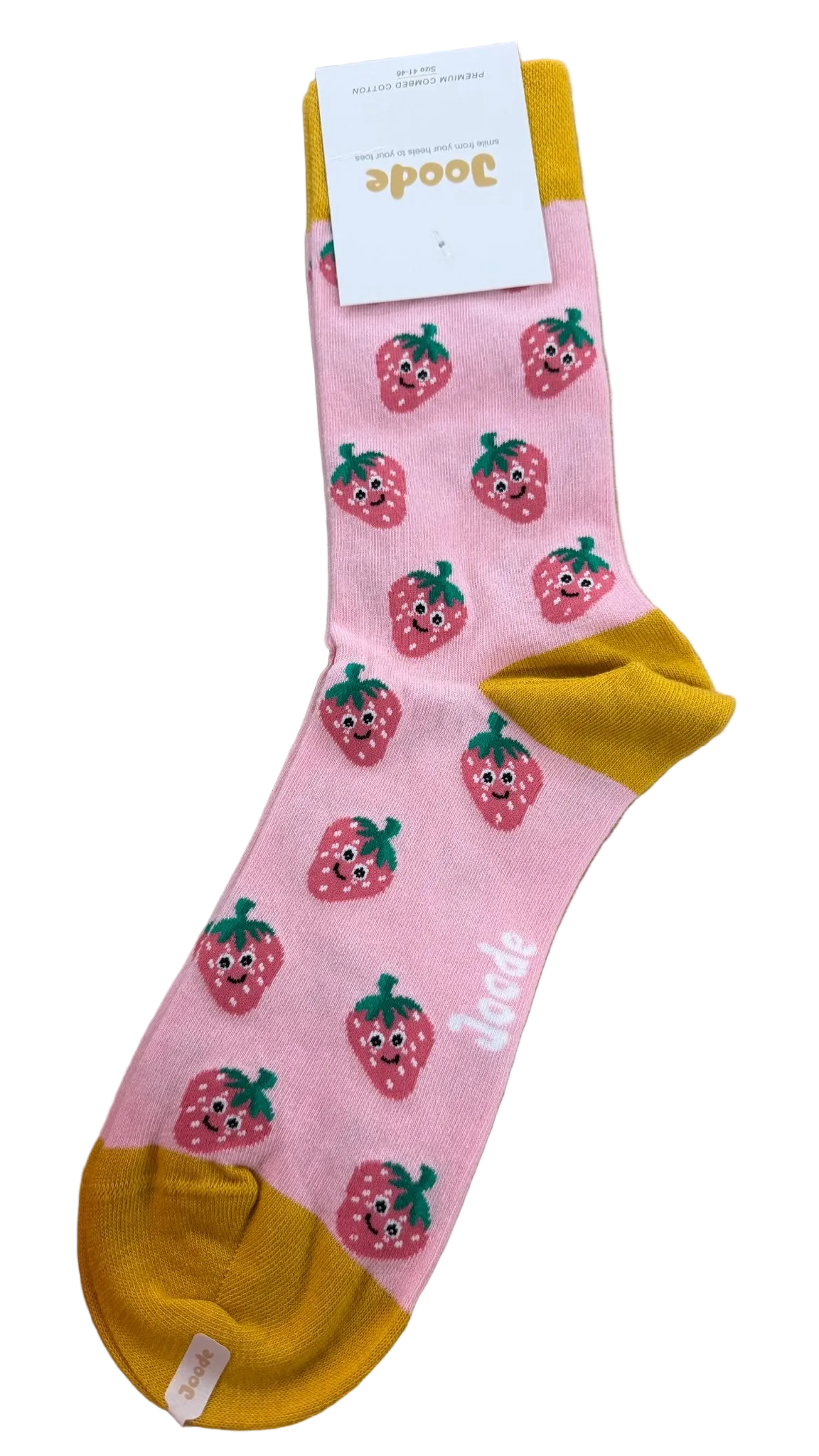 A single pink crew sock with yellow toe and heel sections, decorated with cute strawberry illustrations and the brand name 'Boodee' printed near the foot, resting on a light wood floor.