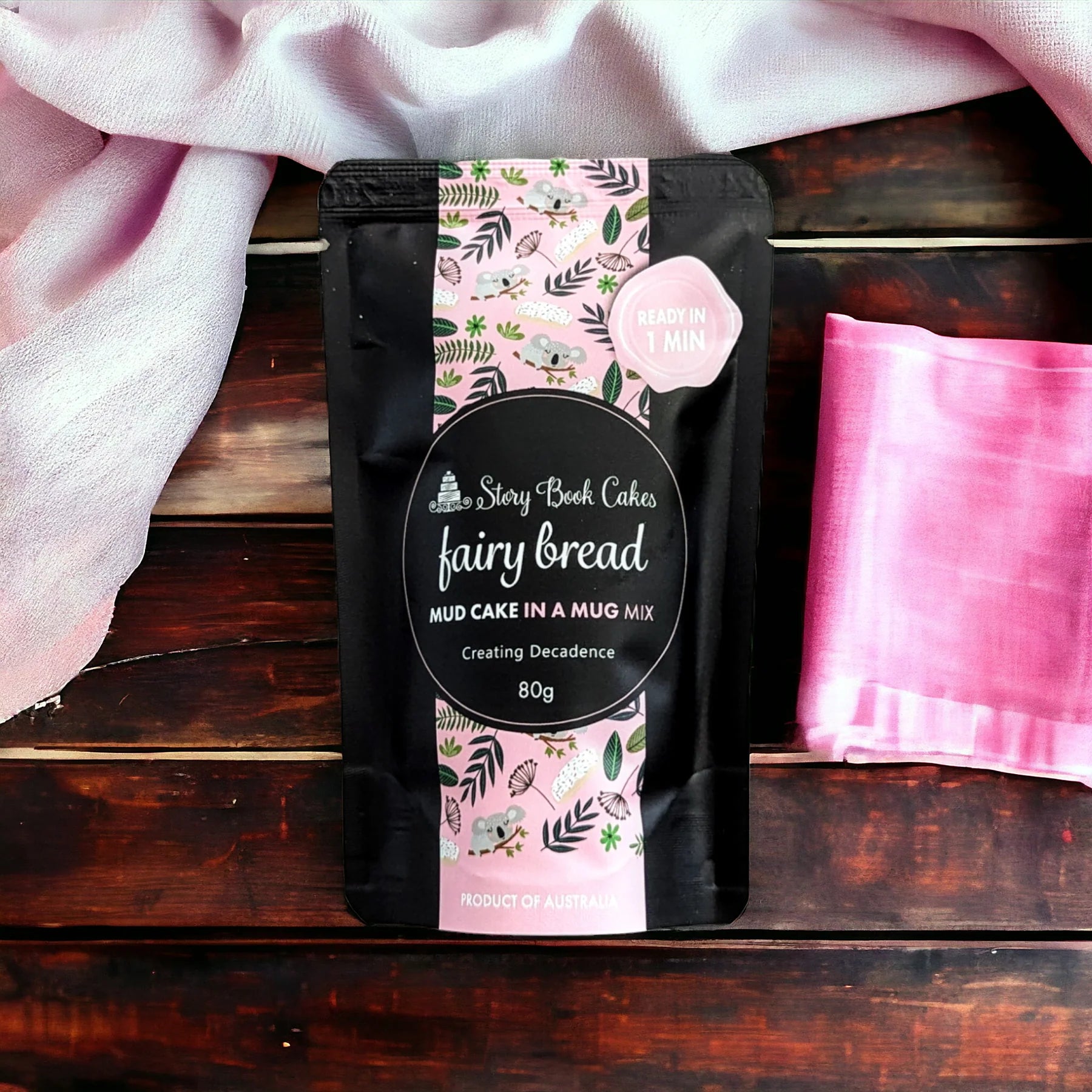 Packaged mud cake in a mug mix with decorative label on a wooden surface
