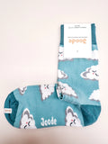 Pair of socks with cloud pattern and 'Joode' branding on a light background